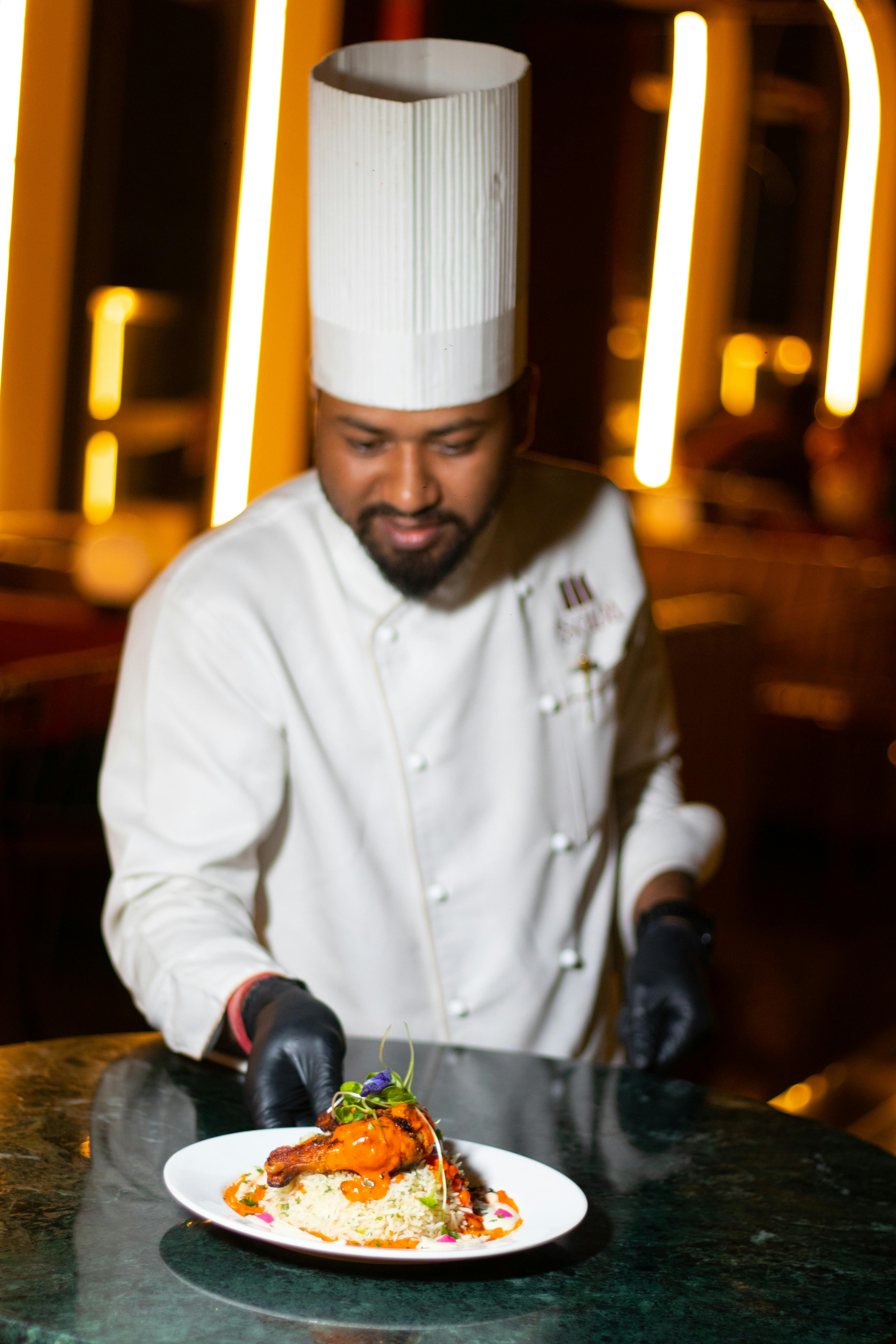 Chef preparing Indian cuisine at Garden Indian Restaurant